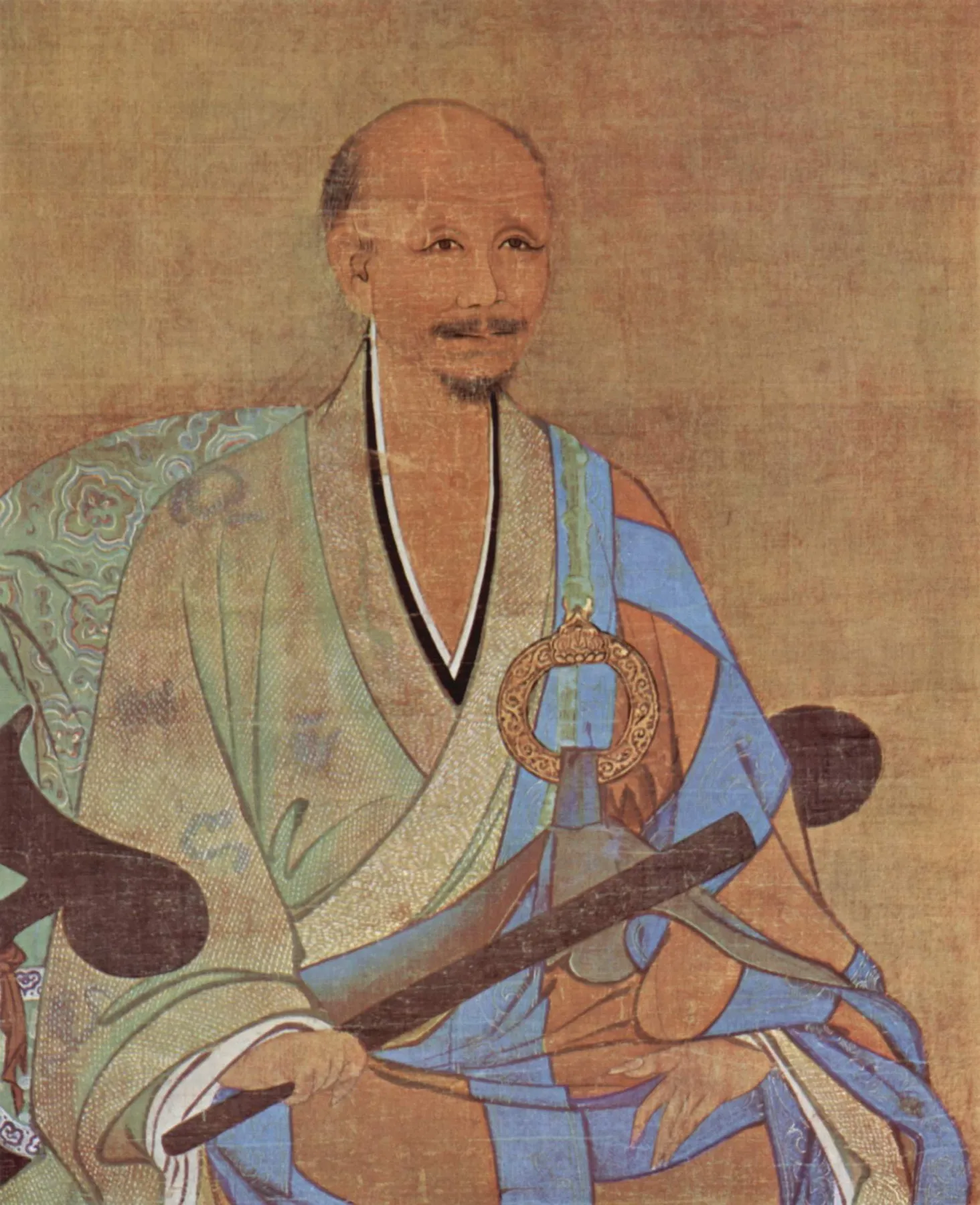 无准师范像：一位光头老僧身披袈裟端坐在椅上，头后没有光环